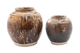 Diana Cargo two Chinese oviform storage jars under brown glazes, Jiaqing, 27 and 21cm high,