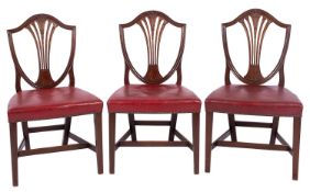 A set of eight mahogany shield-back dining chairs, in George III style,