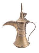 A Middle Eastern brass dallah, late 19th/early 20th century with tall pointed finial,