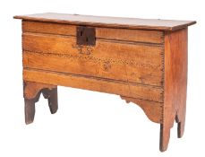 An oak 'six-plank' coffer, 17th century; the top with 'wire' hinges, moulded front and back,