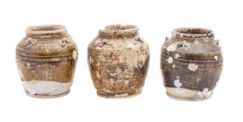 Diana Cargo three Chinese oviform storage jars under brown glazes, Jiaqing, 16cm high,