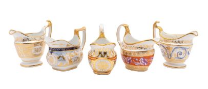 A group of five John Rose Coalport cream jugs, circa 1810 in boat and helmet shapes,