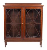 A mahogany and glazed bookcase in Regency taste,