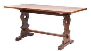 An oak trestle dining table,
