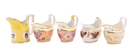 A collection of nine early 19th century English porcelain cream jugs various factories including