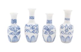 Vung Tau cargo four miniature porcelain 'Dolls House' vases painted with stylised scrolls above a
