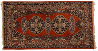 A Turkoman rug, the camel field with two rows of quartered guls,
