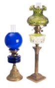 A brass and green-tinted glass columnar table oil lamp,