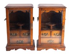 Two very similar oak table-top smoker's cabinets,