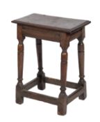 An oak joint stool, 17th century and later elements; the rectangular seat with moulded edges,