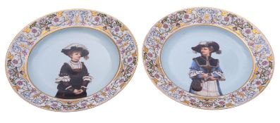 A pair of Continental porcelain plates each decorated with a three quarter portrait of an