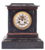 A late-Victorian French black marble mantel clock with visible escapement the eight-day duration