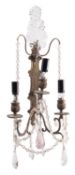 A pair of silvered metal and glass hung three-light wall appliques, in 18th century taste,