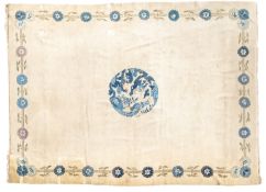 A Chinese carpet, the beige field with a circular central blue medallion,