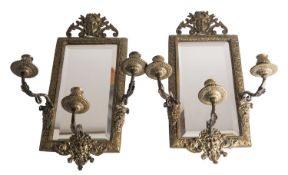 A pair of brass three light girandoles in Louis XIV style,