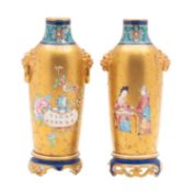 A pair of Royal Worcester 'Aesthetic' porcelain vases of slender cylindrical form with pierced foot
