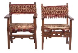 Two similar walnut and upholstered open elbow chairs,
