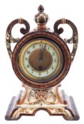 A late-Victorian French majolica mantel clock having an eight-day duration timepiece movement,