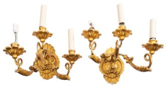 A pair of carved and giltwood three-light wall appliques, in Louis XV taste,