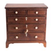 A miniature mahogany and ebony banded chest of drawers in Regency style,
