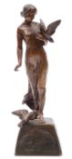 A Continental patinated bronze group of a maiden with doves,