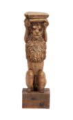 A carved oak herm or pilaster support modelled as a lion,