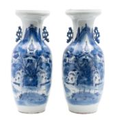 A pair of Chinese porcelain vases of baluster form with pierced rustic handles painted in blue with