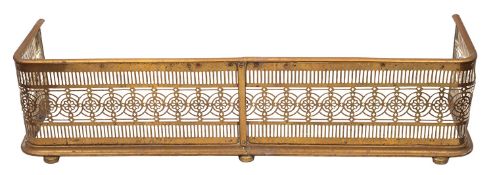 A Regency brass fender,
