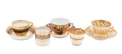 A John Rose Coalport trio; a similar teacup and saucer; and a Spode trio,