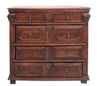 An oak and walnut chest of drawers,
