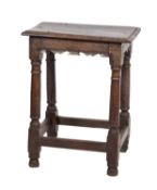 A Jacobean oak joint stool, later 17th century; the rectangular top with moulded edges,