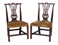 A pair of George III mahogany side chairs,