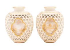 A pair of small Royal Worcester double-walled reticulated vases attributed to George Owen,