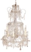 A cut glass six light chandelier in Regency style,