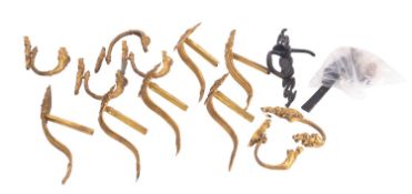 A group of gilt metal curtain tie-backs,