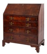 A late George II or George III walnut and banded bureau,