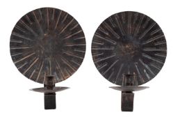 A pair of patinated copper wall appliques,