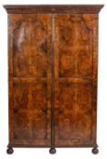 A burr walnut wardrobe in Queen Anne taste,