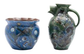 Two pieces C H Brannam [Barnstaple] pottery comprising a fish jug sgraffito decorated with coloured