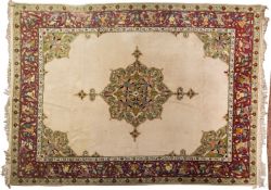 A Connemara carpet the ivory field with a central green shaped and pointed medallion,
