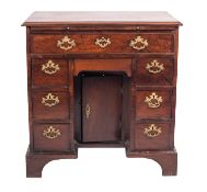 A George III mahogany kneehole desk,