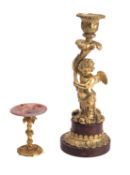 A Napoleon III gilt bronze and rouge griotte marble figural candlestick,