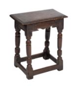A Jacobean oak joint stool,