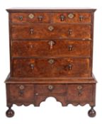 A late George I or George II walnut and feather banded chest on stand,