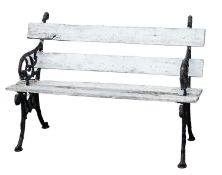 An Edwardian cast iron and painted wood garden bench,