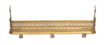 A Regency brass fender, early 19th century; of rectangular form,