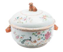 A Chinese porcelain soup tureen of circular form with rabbit's head handles and Shi Shi knop