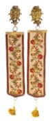A pair of Berlin woolwork and gilt bronze mounted bell-pulls;