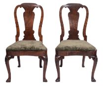 A pair of George I walnut side chairs,