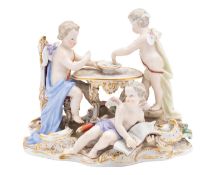 A Meissen group of the Bindfolded Cupid with two putti,
